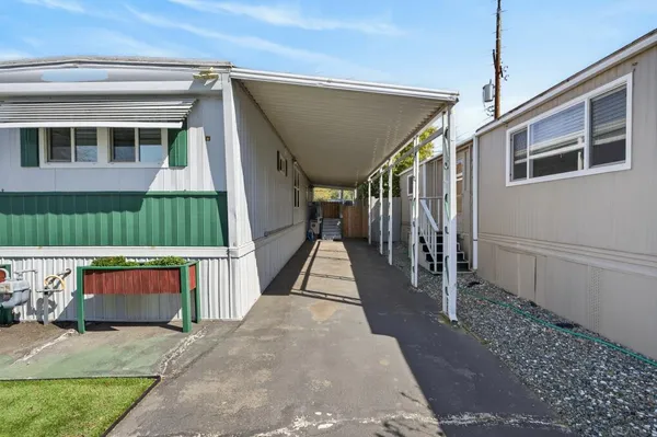 an aerial view of residential house with outdoor space and parking
