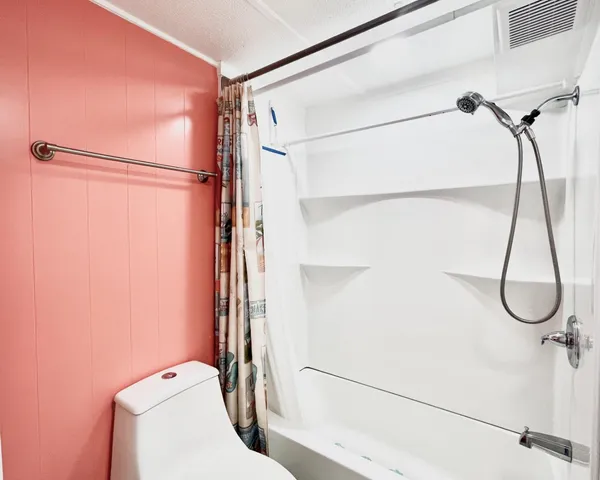 a bathroom with a granite countertop shower and a sink