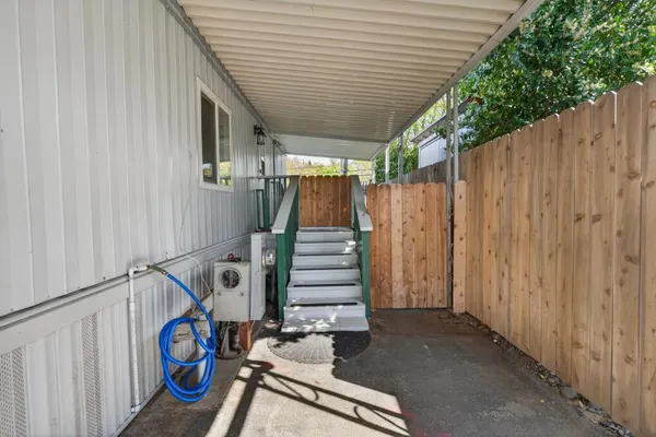an aerial view of a house a yard and outdoor seating