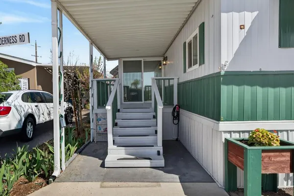a kitchen with granite countertop a refrigerator stove and oven