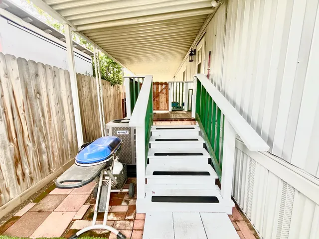 a view of entryway with wooden floor and door