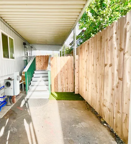 a front view of house with yard and outdoor seating
