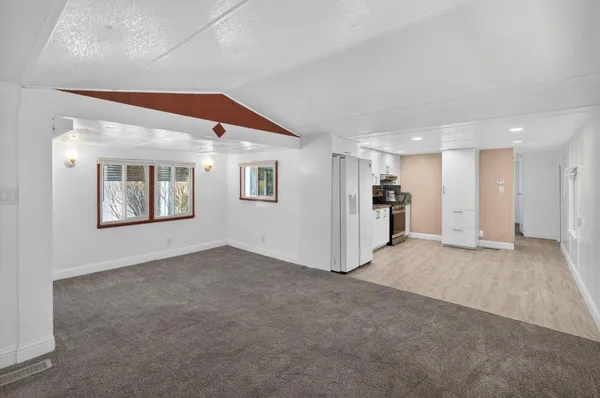 a stove top oven sitting inside of a kitchen