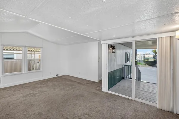 a kitchen with granite countertop a stove sink and cabinets
