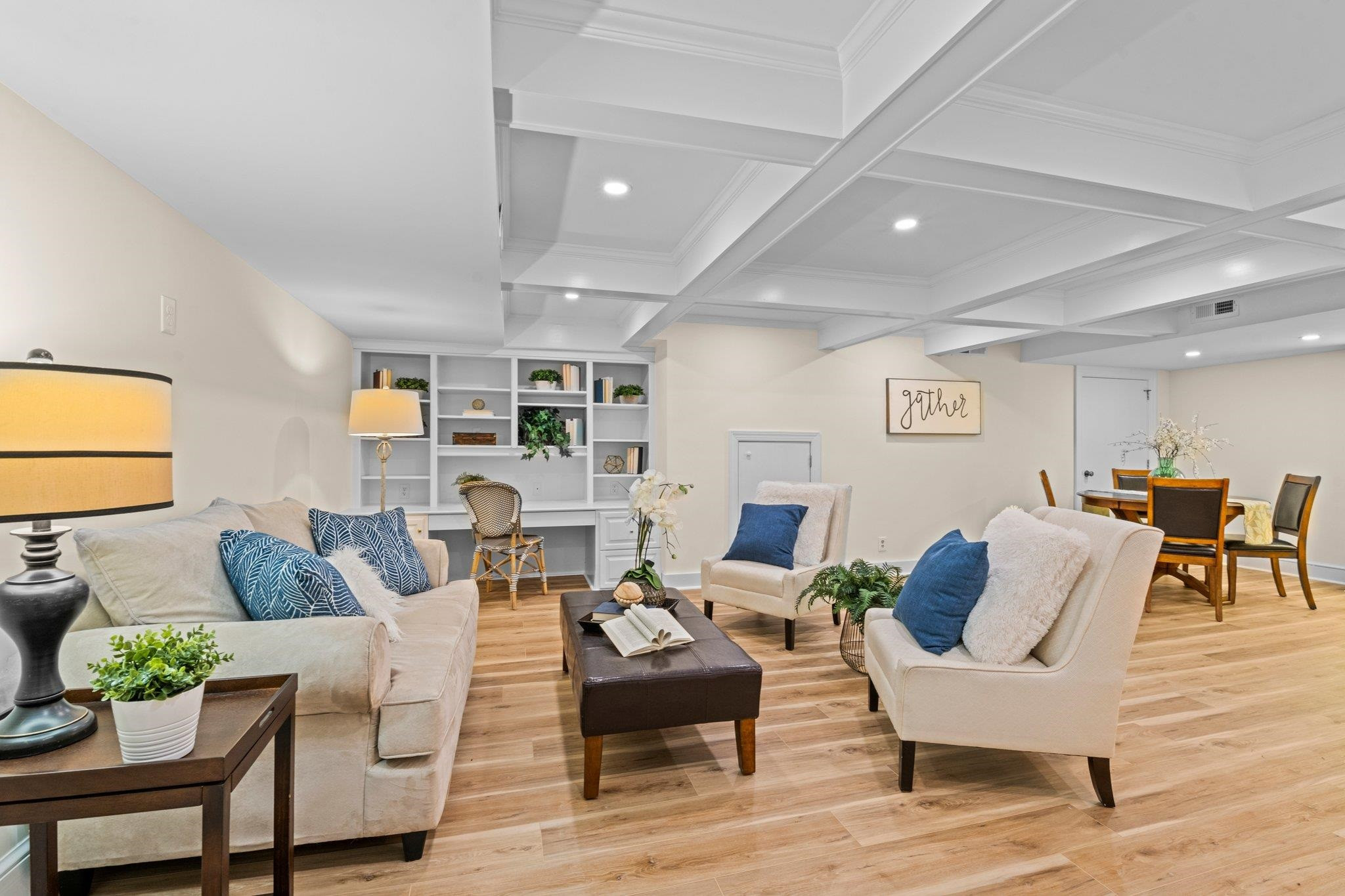 2217 St Marys Street Raleigh, NC 27608 - Photo 33 of 52 Beautifully finished basement with LVP Flooring and coffered ceiling. Full Finished Basement