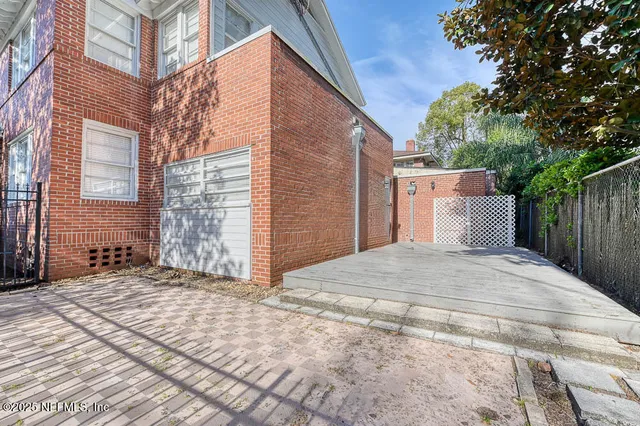 a view of a backyard of the house