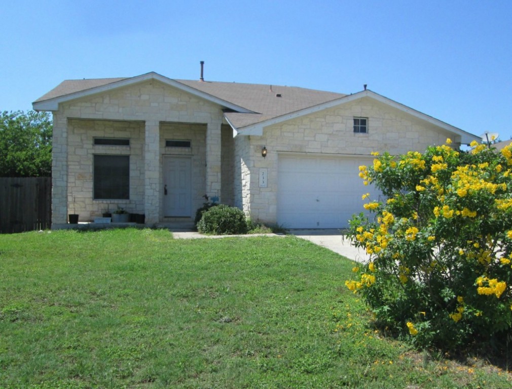233 Spring Branch Loop Kyle, TX 78640 - Photo 1 of 1 front view of a house with a yard