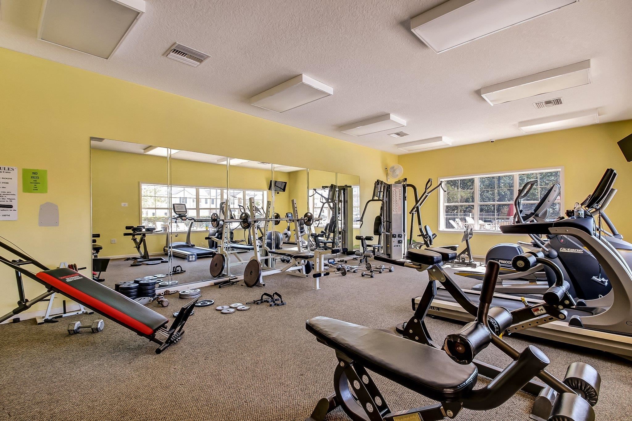 1217 Golden Lake Loop St. Augustine, FL 32084 - Photo 31 of 32 a room with gym equipment and windows