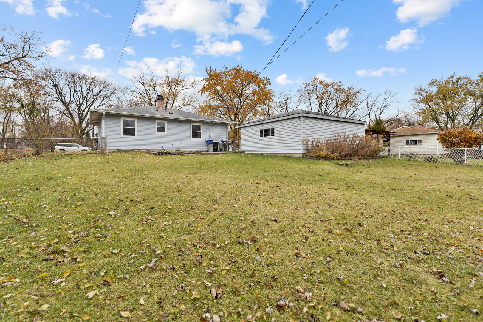 6971 Hanover Street Hanover Park, IL 60133 - Photo 16 of 20 a view of a house with a yard