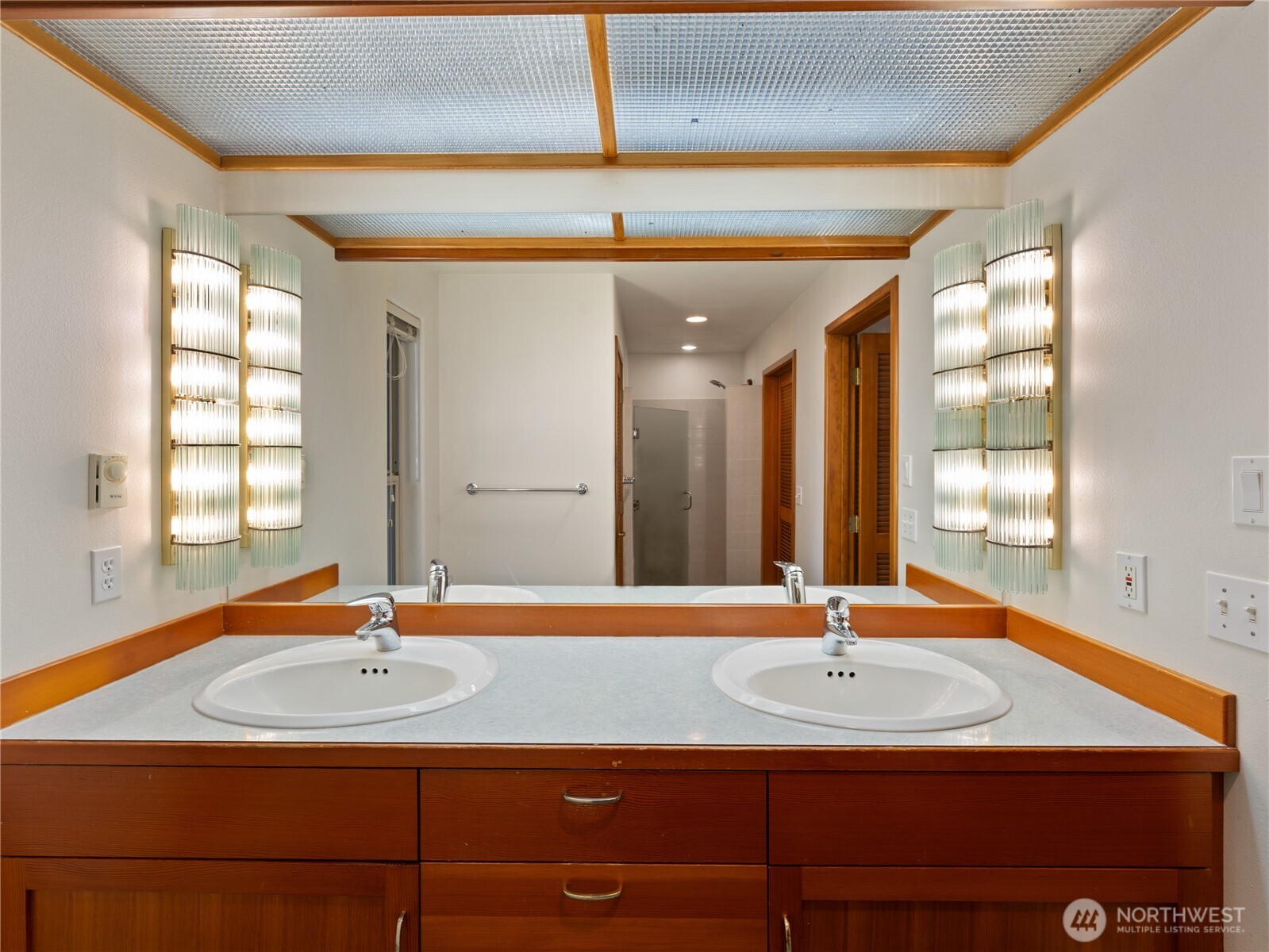 2204 41st Street Anacortes, WA 98221 - Photo 19 of 36 a bathroom with a sink and a mirror