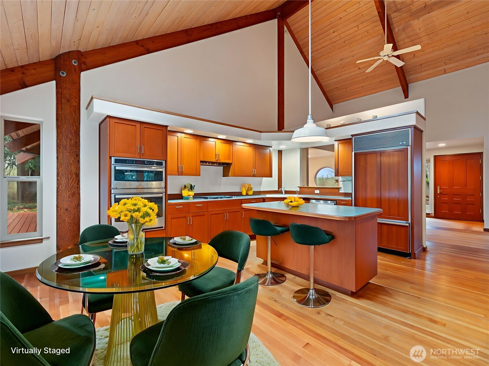 2204 41st Street Anacortes, WA 98221 - Photo 2 of 36 a view of a dining room with furniture a chandelier and wooden floor