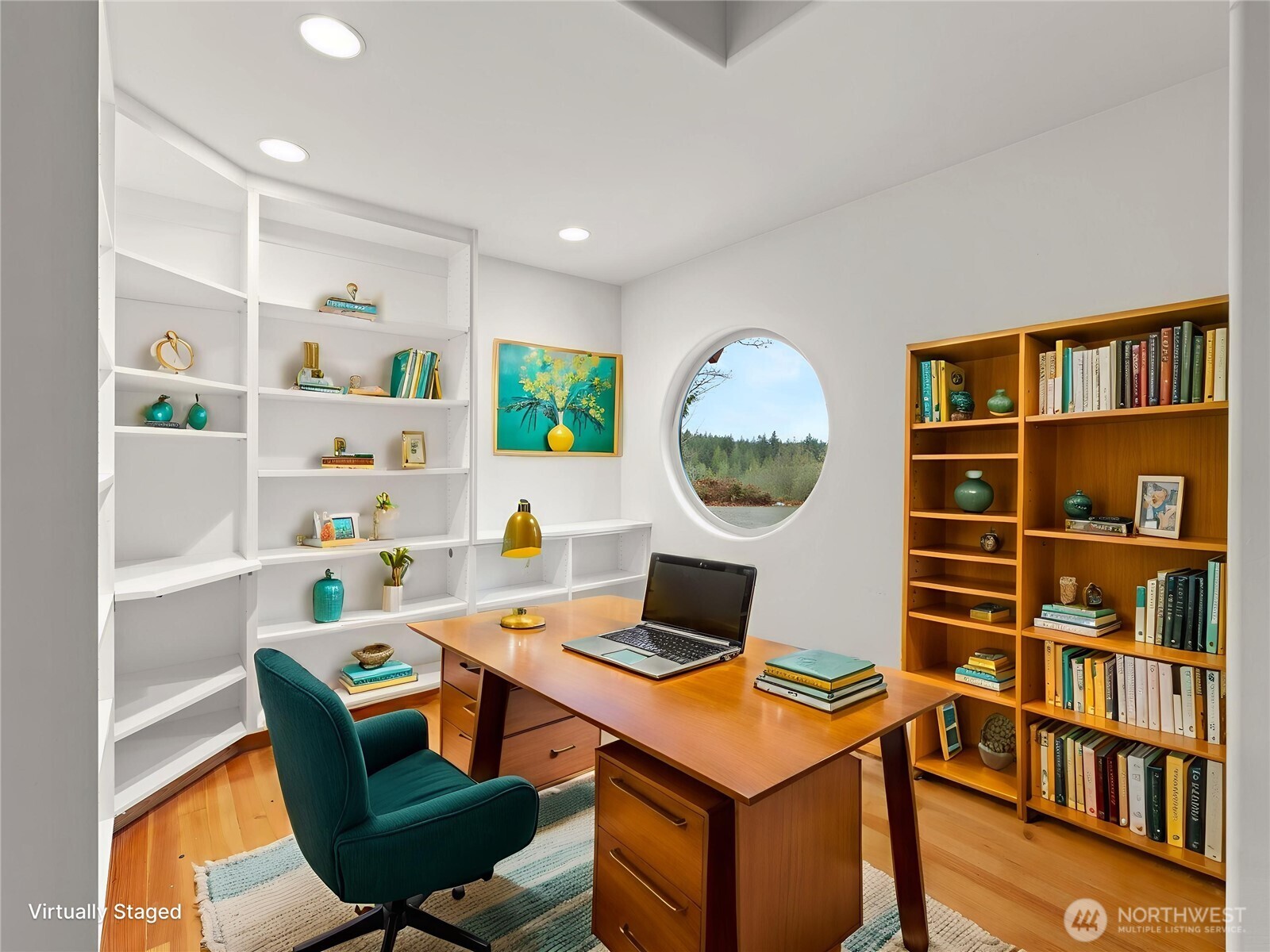 2204 41st Street Anacortes, WA 98221 - Photo 22 of 36 a view of a workspace with furniture and a bookshelf