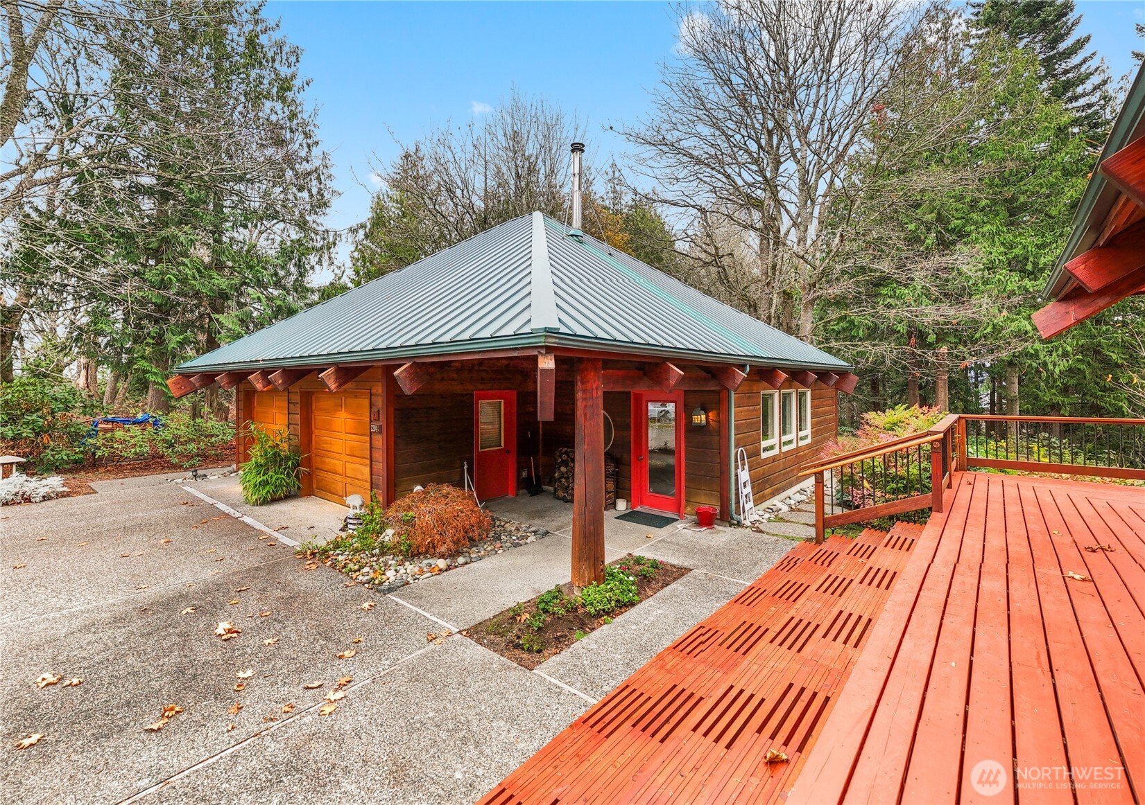 2204 41st Street Anacortes, WA 98221 - Photo 28 of 36 a front view of a house with swimming pool and sitting area