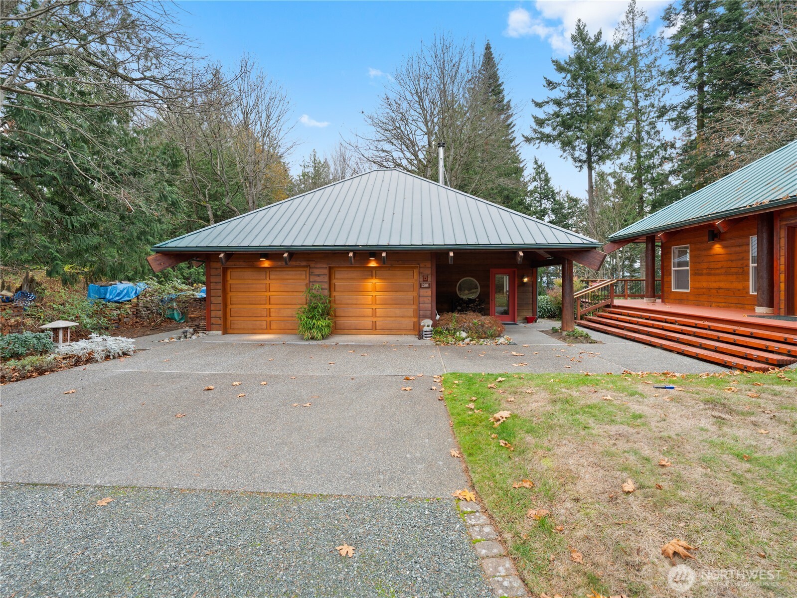 2204 41st Street Anacortes, WA 98221 - Photo 29 of 36 a backyard of a house with barbeque oven and outdoor seating