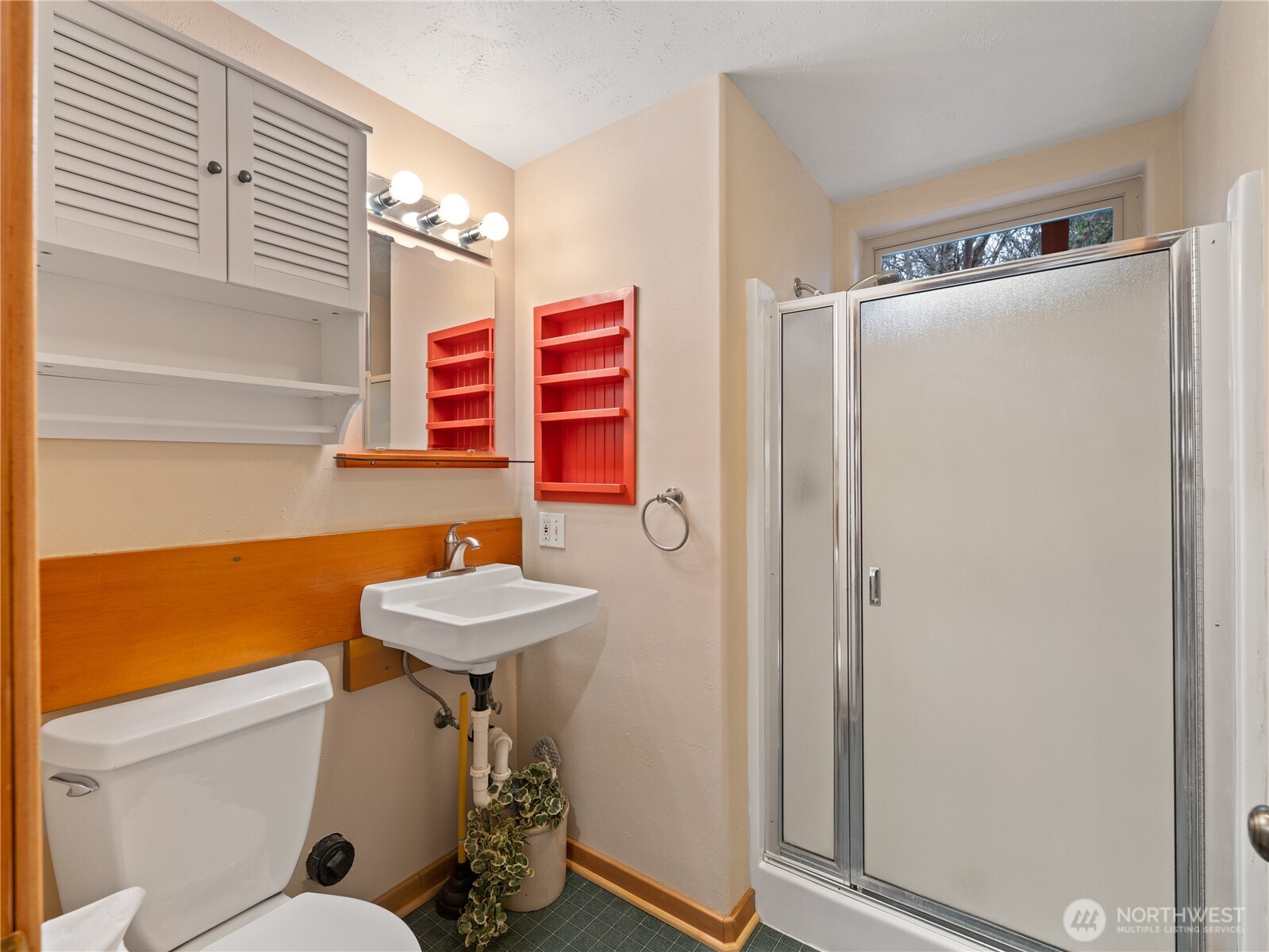 2204 41st Street Anacortes, WA 98221 - Photo 33 of 36 a bathroom with a sink a toilet and shower