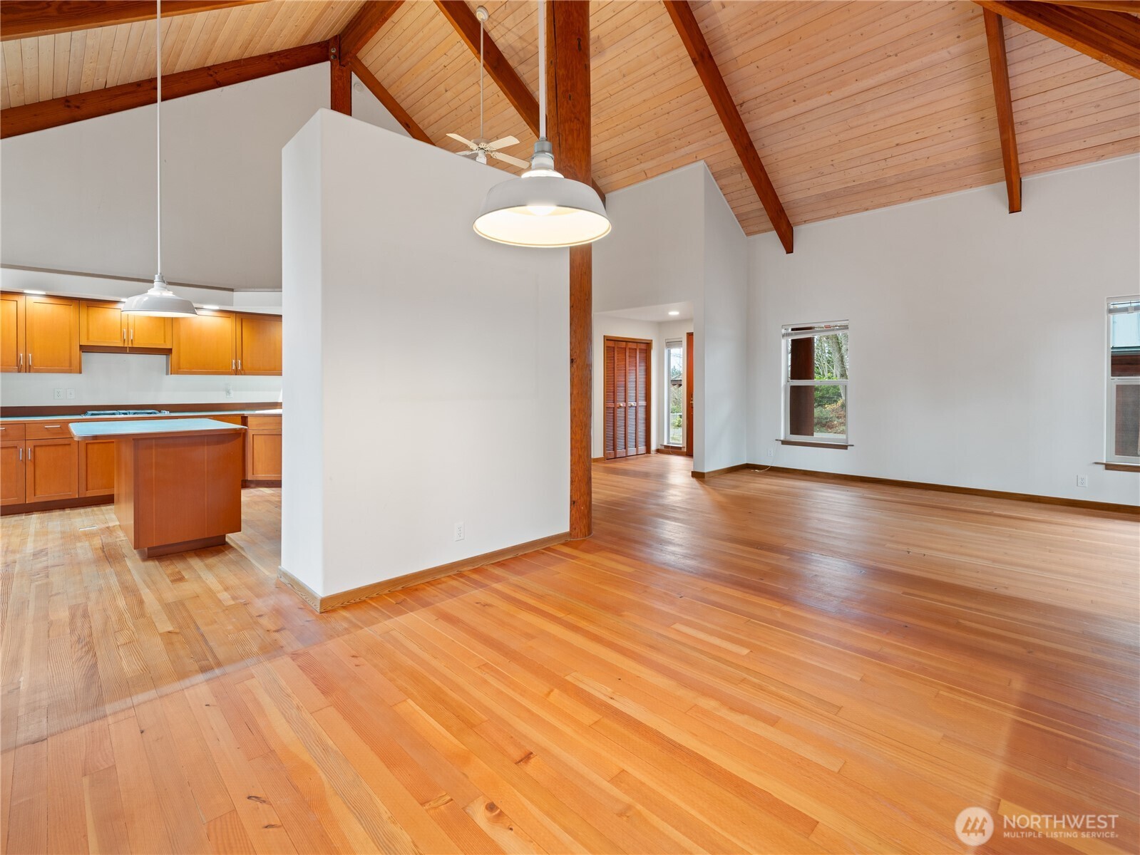 2204 41st Street Anacortes, WA 98221 - Photo 7 of 36 a view of a livingroom with an empty space and a kitchen