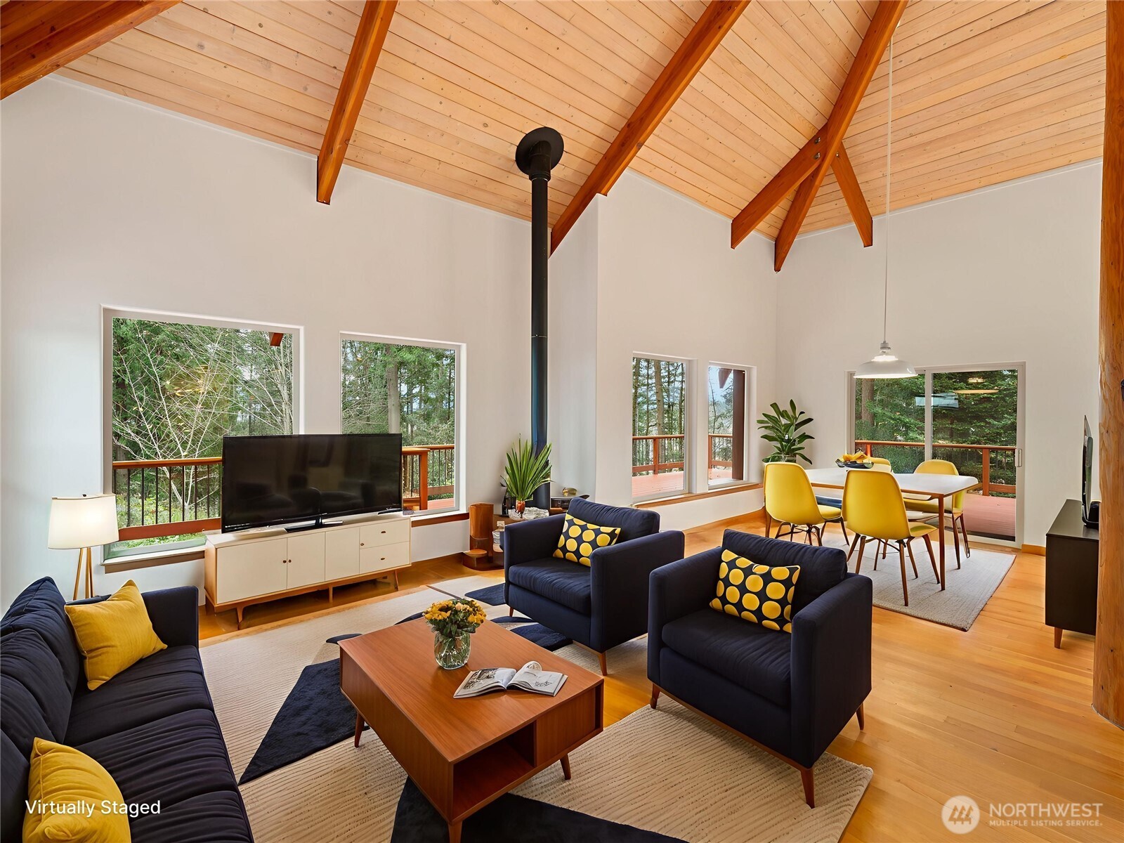 2204 41st Street Anacortes, WA 98221 - Photo 9 of 36 a living room with furniture a large window and a flat screen tv