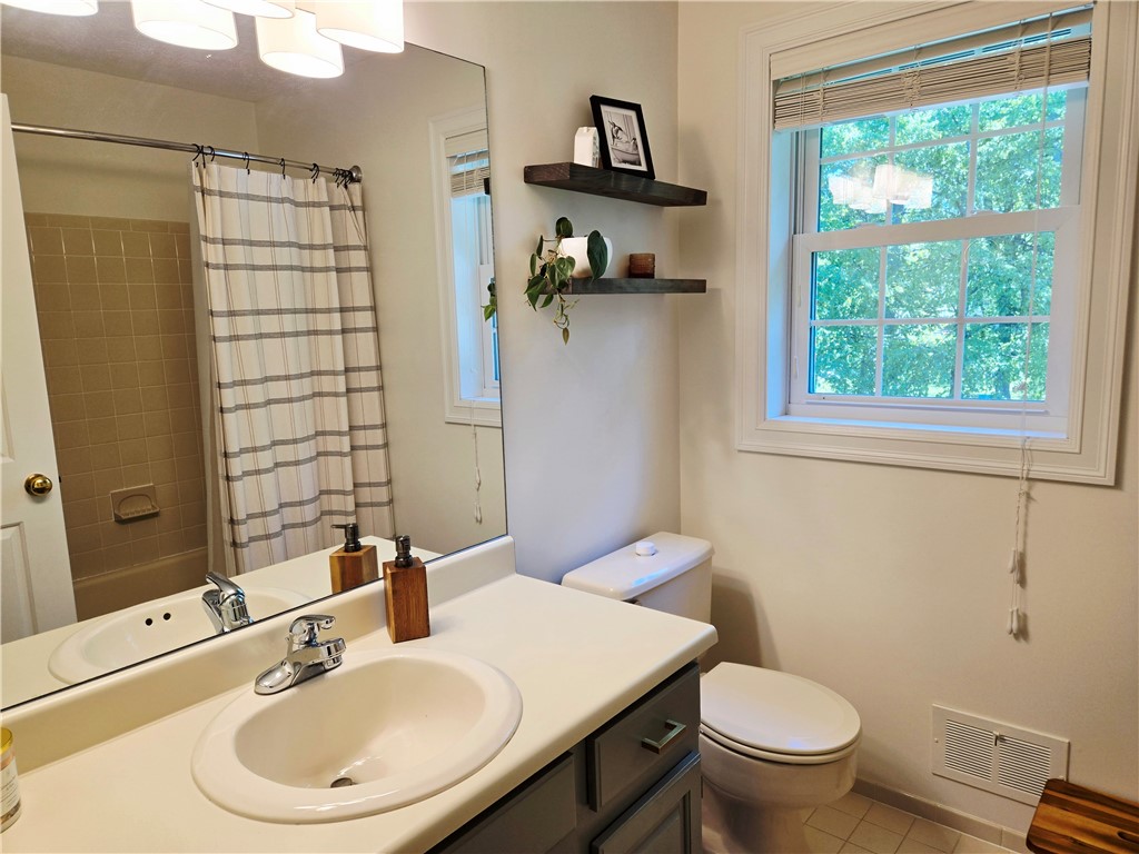 1081 Bright Stream Way Webster, NY 14580 - Photo 36 of 50 The main bathroom has plenty of space and a tub/shower combo.