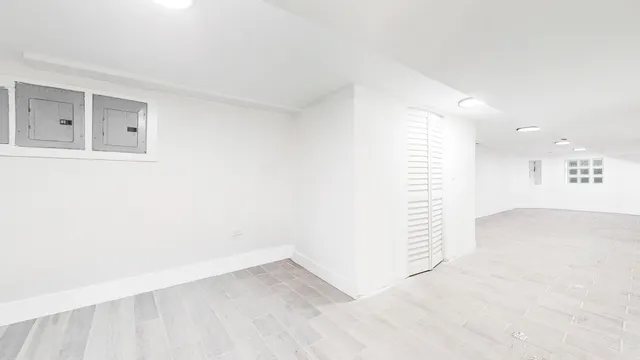 a view of a room with wooden floor