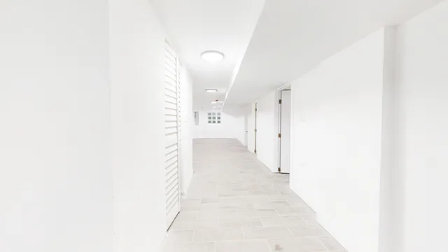 a view of a hallway with white walls