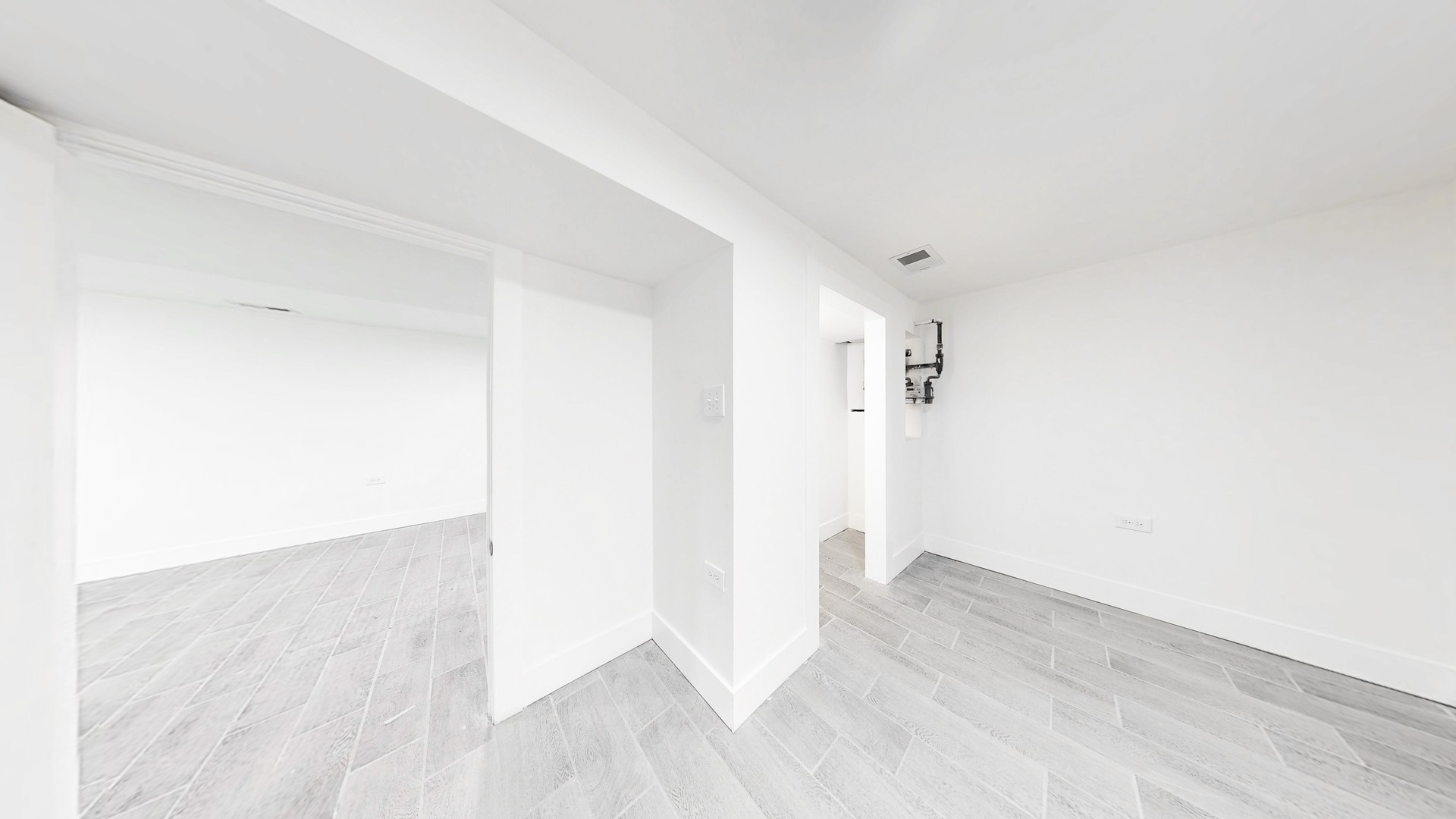 6137 South Morgan Street Chicago, IL 60621 - Photo 29 of 33 an empty room with wooden floor