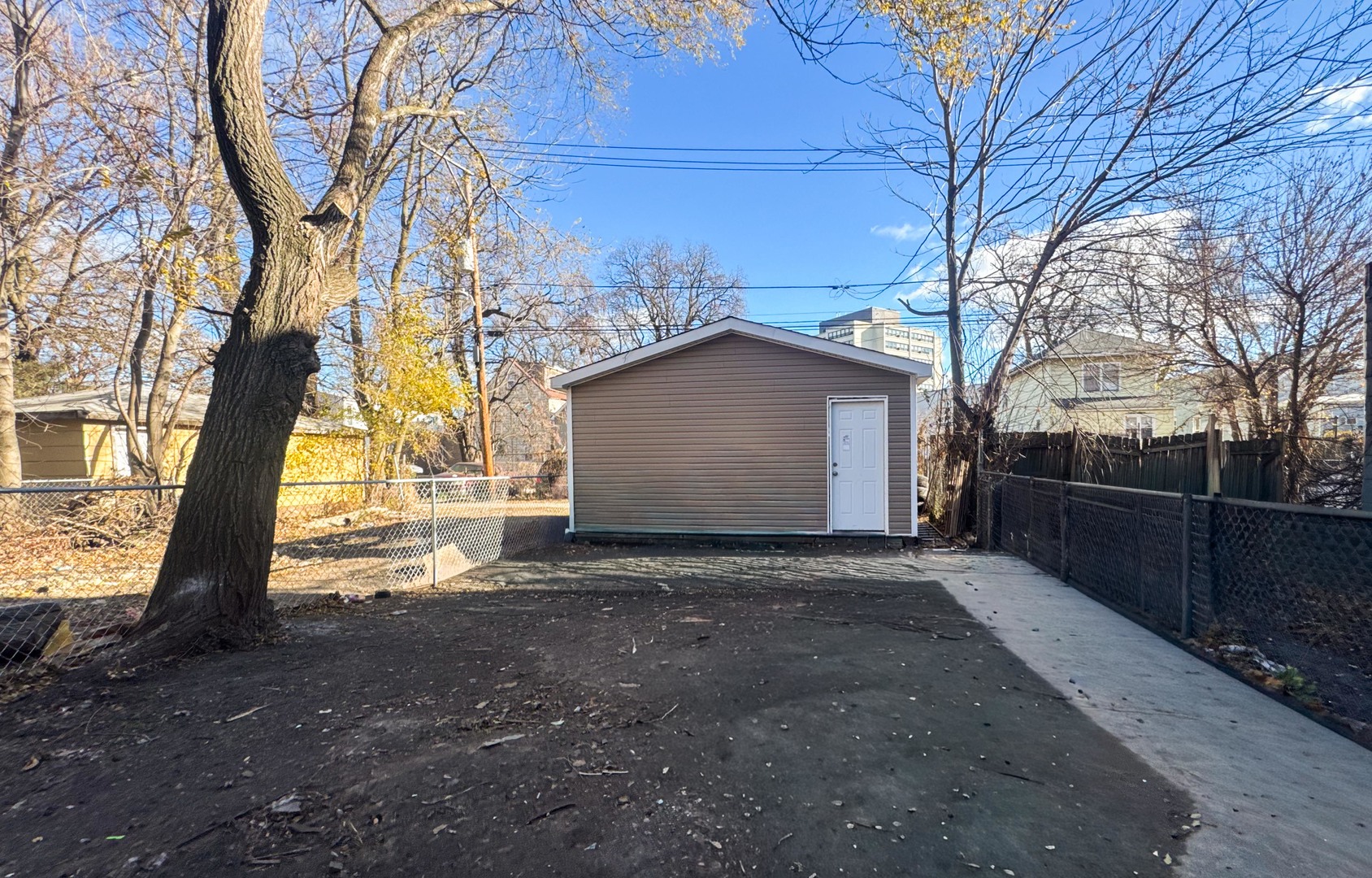 6137 South Morgan Street Chicago, IL 60621 - Photo 32 of 33 a view of backyard and tree