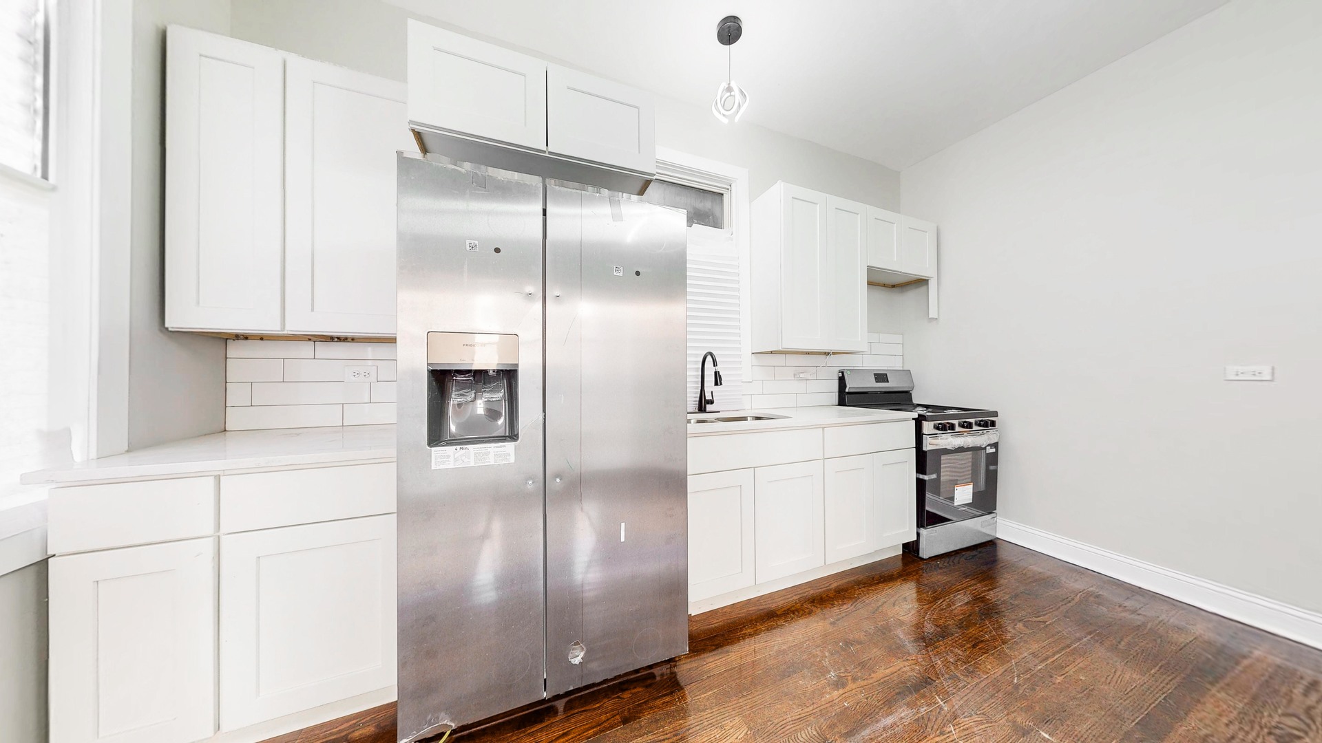 6137 South Morgan Street Chicago, IL 60621 - Photo 6 of 33 a kitchen with stainless steel appliances a refrigerator and a stove