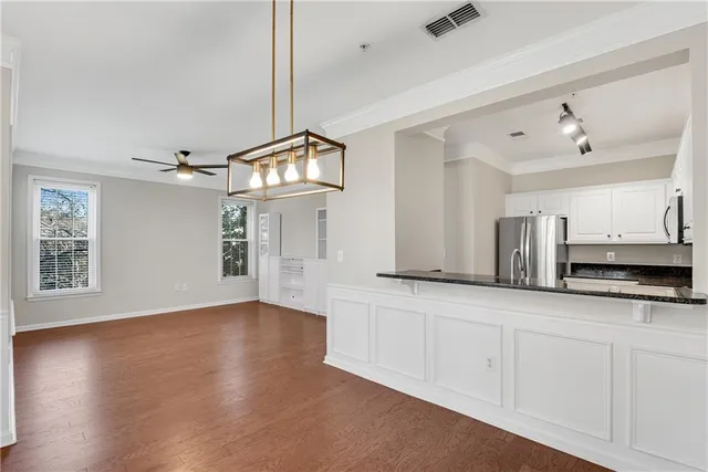a view of a kitchen with electric appliances