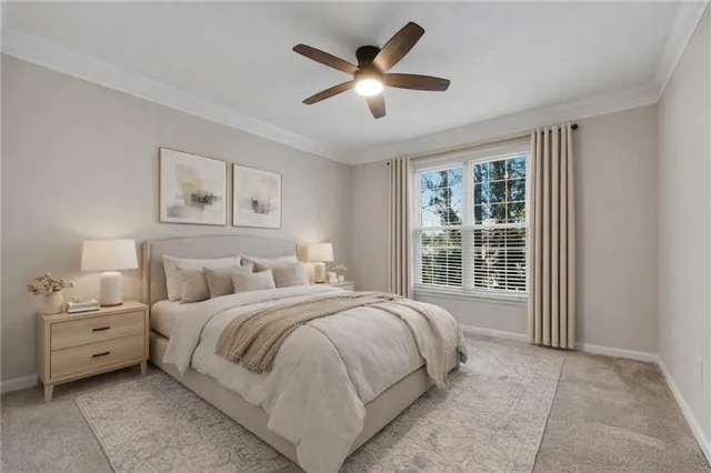 a bedroom with a large bed and a large window