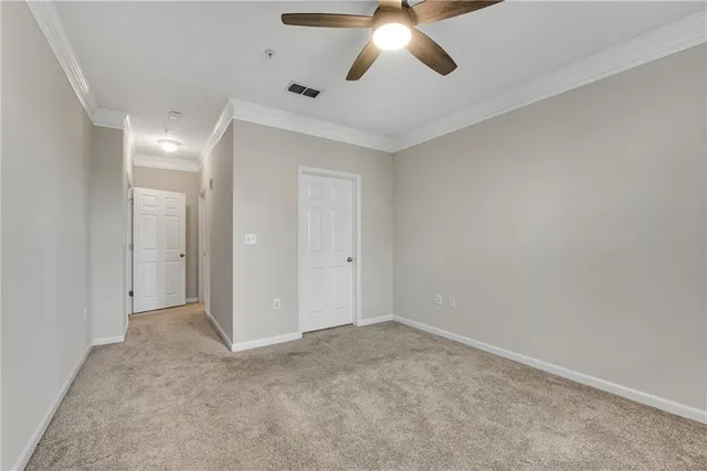 an empty room with fan