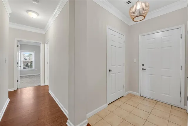 wooden floor in a hallway with wooden cabinet