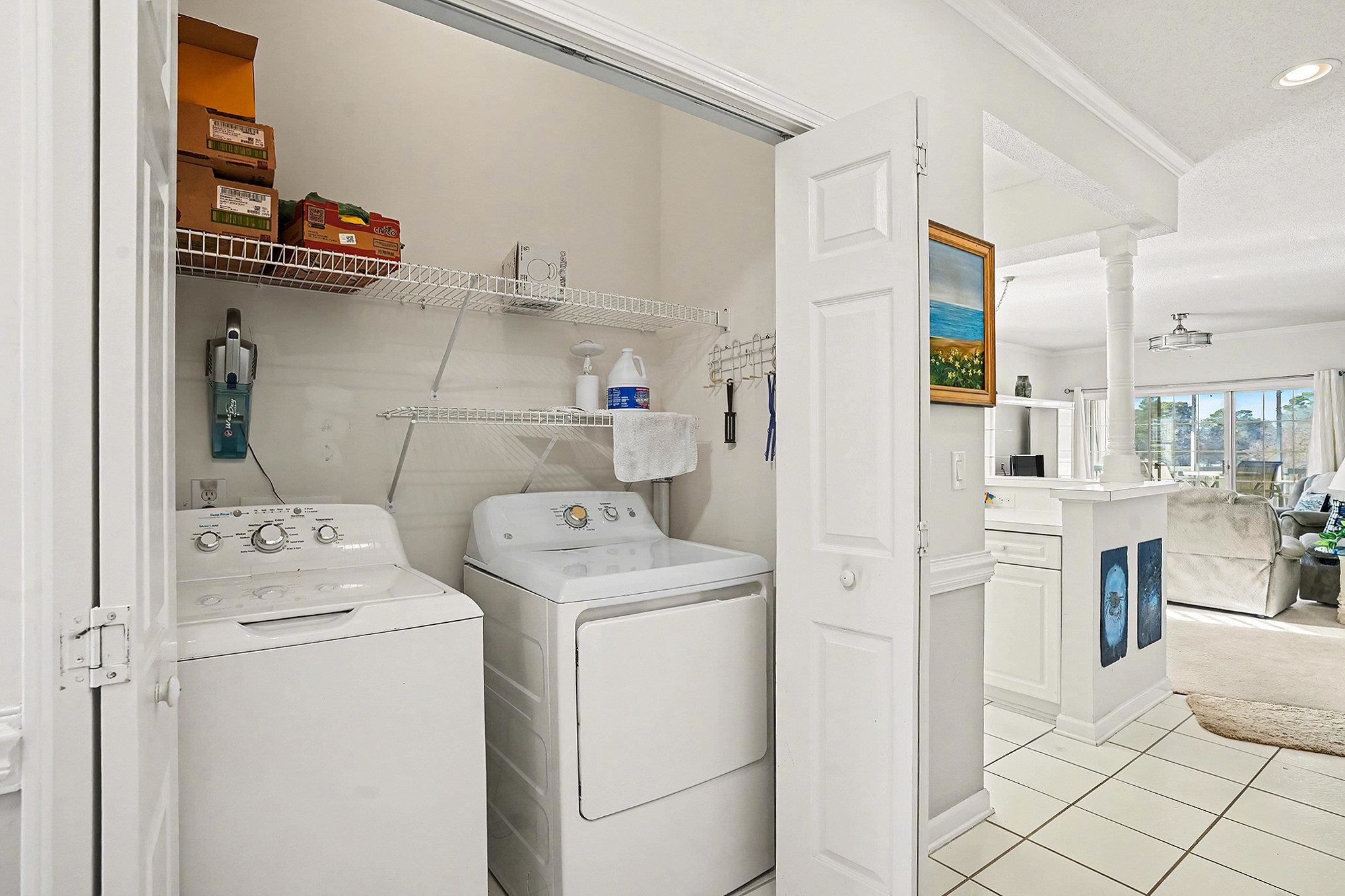 4429 Turtle Lane, Unit 3A Little River, SC 29566 - Photo 14 of 31 Washroom featuring crown molding, washing machine and clothes dryer, light tile patterned floors, recessed lighting, and ornate columns