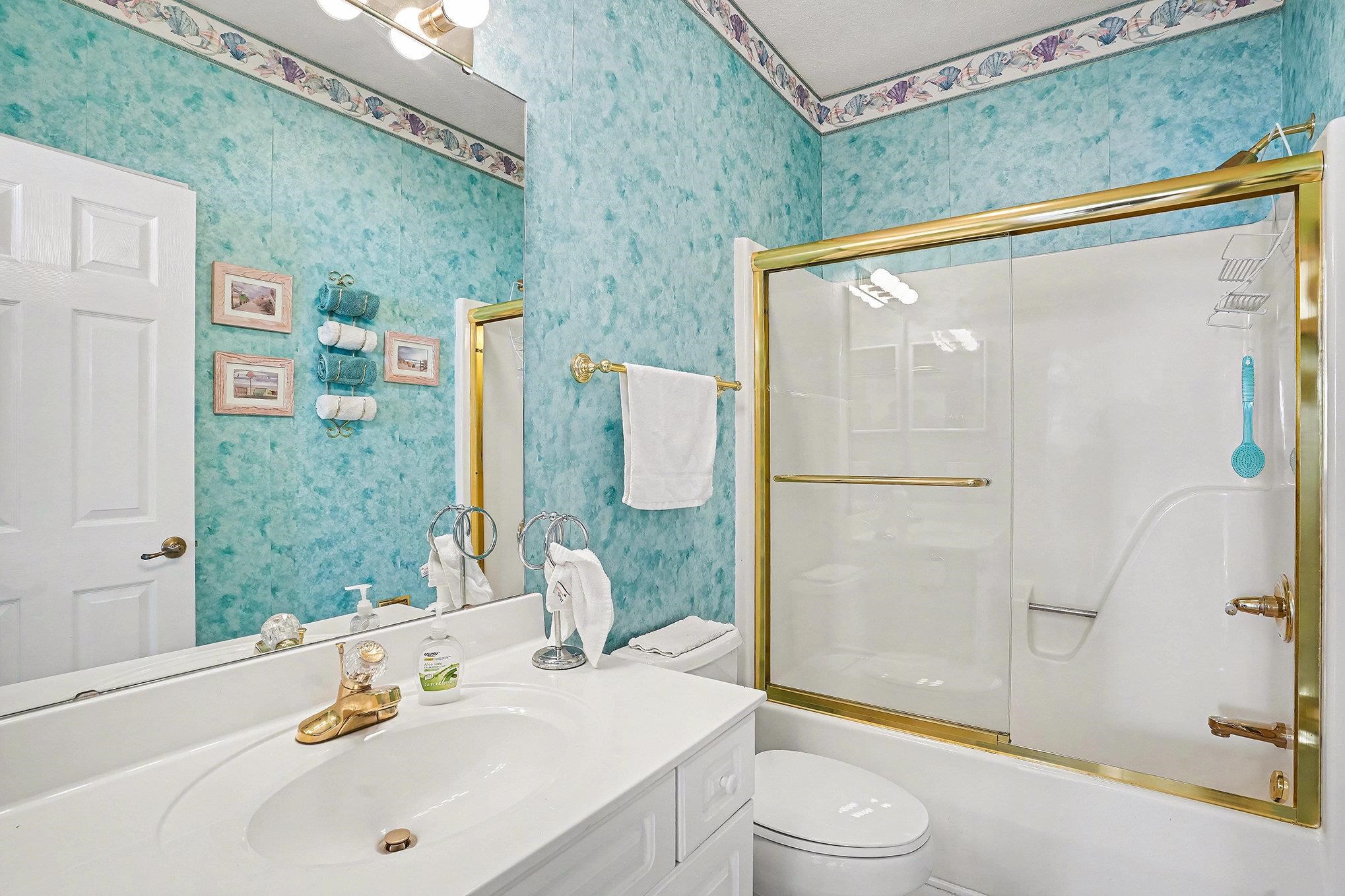 4429 Turtle Lane, Unit 3A Little River, SC 29566 - Photo 23 of 31 Bathroom with vanity, enclosed tub / shower combo, and wallpapered walls
