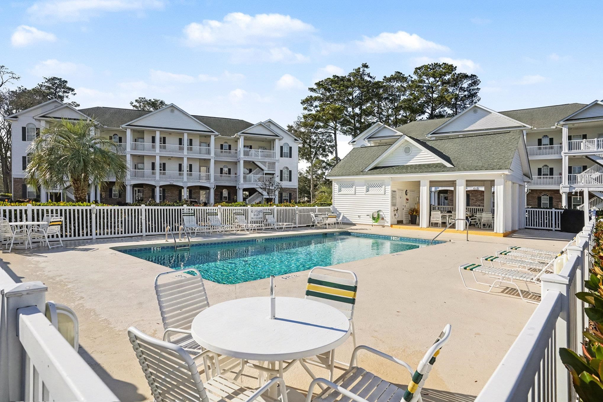 4429 Turtle Lane, Unit 3A Little River, SC 29566 - Photo 26 of 31 Community pool featuring a patio