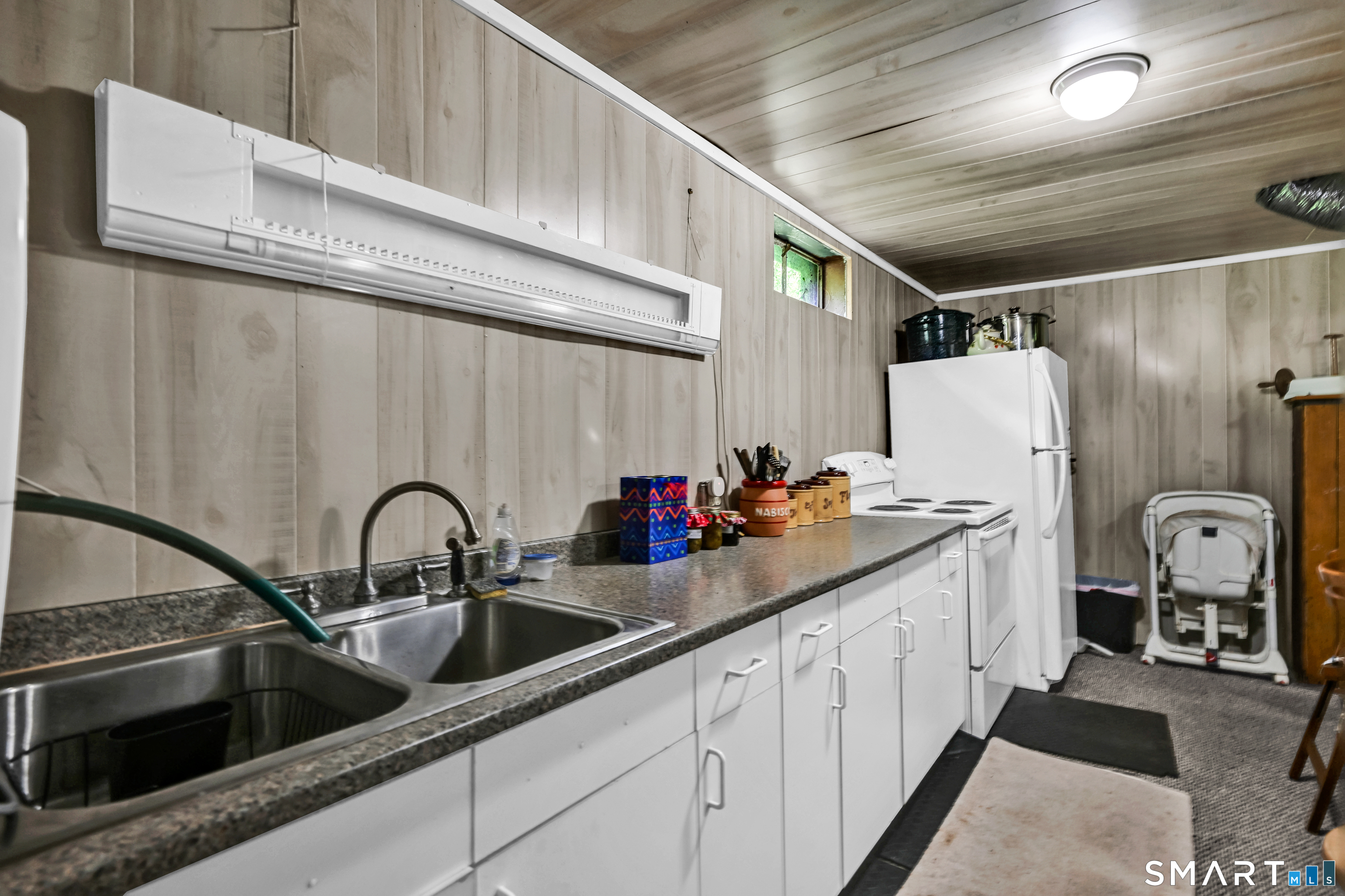 155 Lake Harwinton Road Harwinton, CT 06791 - Photo 34 of 39 a kitchen with refrigerator and sink
