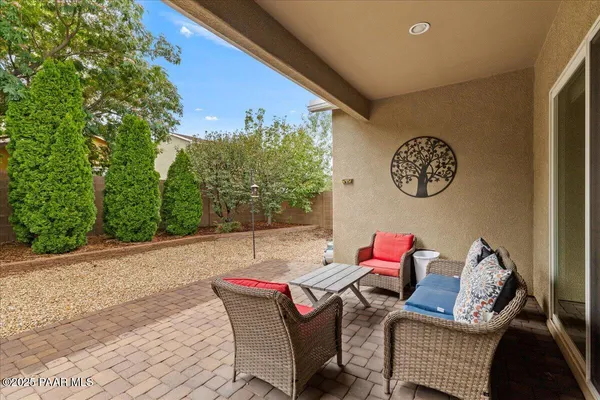 a outdoor living space with furniture and garden view