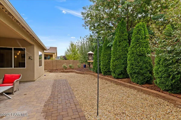 a view of a backyard with sitting area