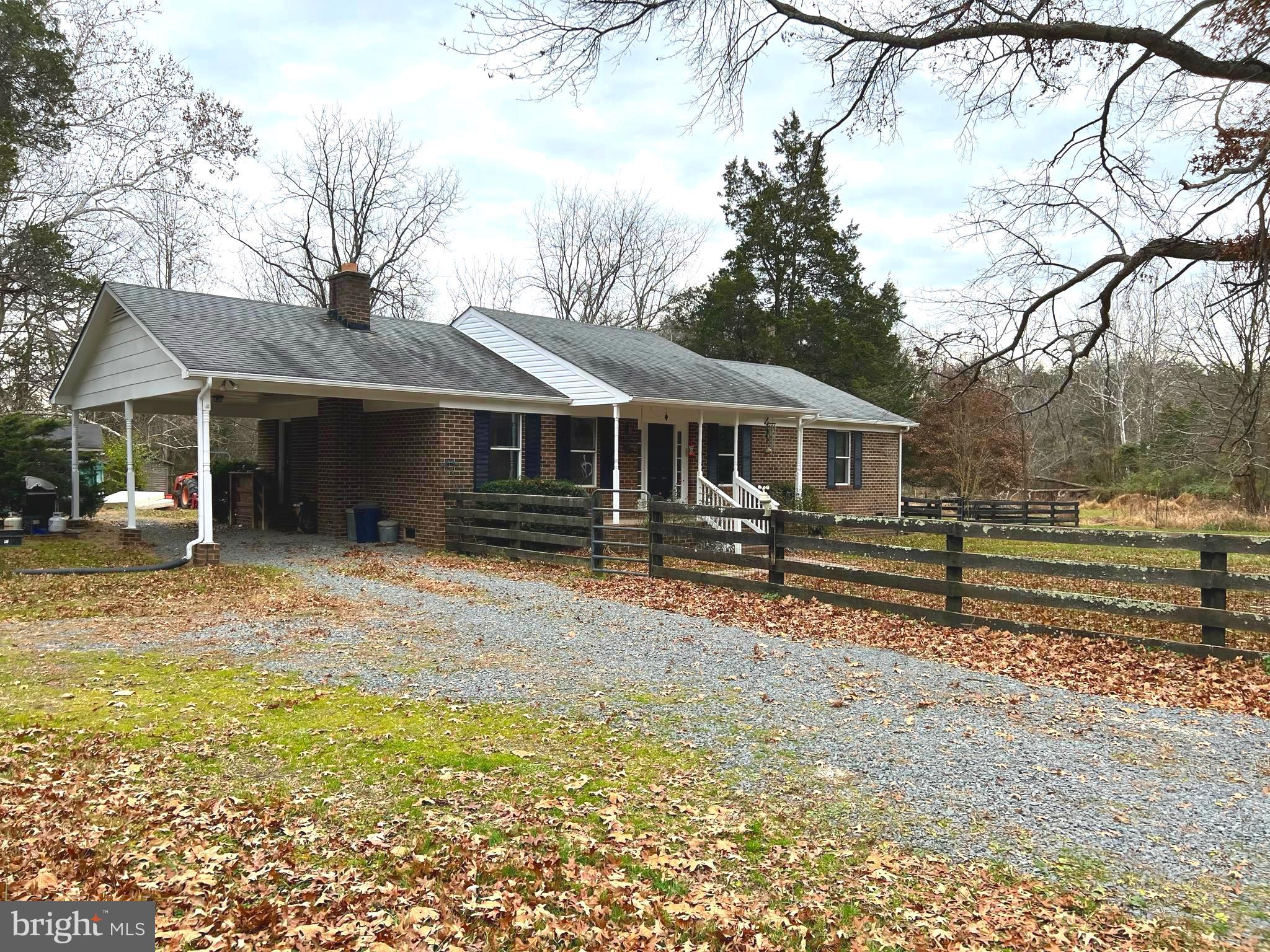 8307 Kines Road Warrenton, VA 20187 - Photo 17 of 46 Driveway, Carport and fenced Front Yard.