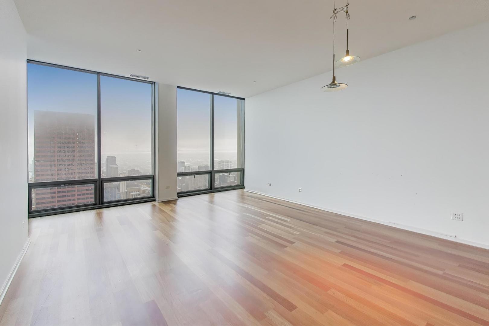 65 East Monroe Street, Unit 4405 Chicago, IL 60603 - Photo 2 of 27 a view of an empty room with wooden floor