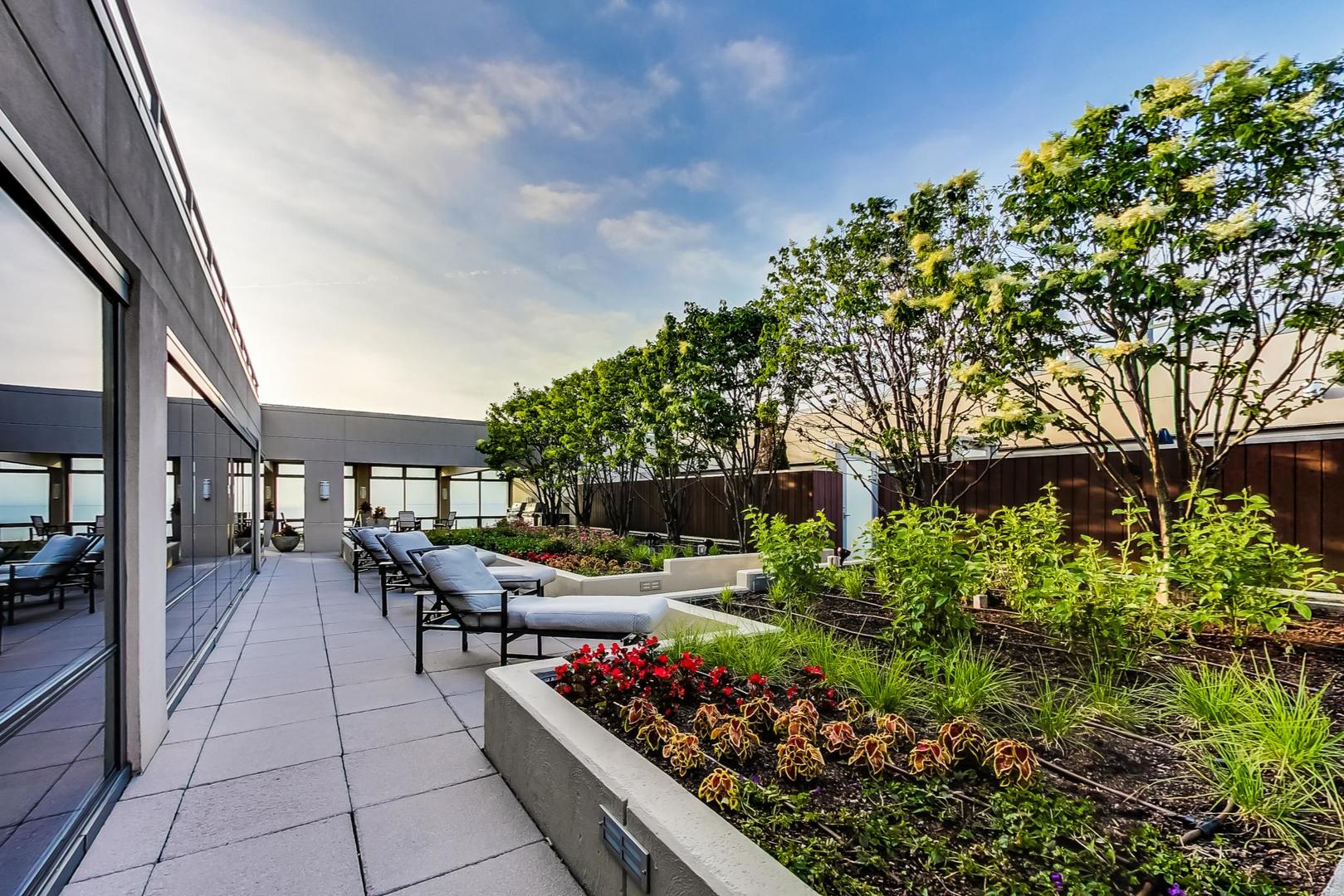 65 East Monroe Street, Unit 4405 Chicago, IL 60603 - Photo 23 of 27 a outdoor space with lots of plants and trees