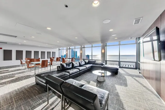 a living room with lots of furniture and a table