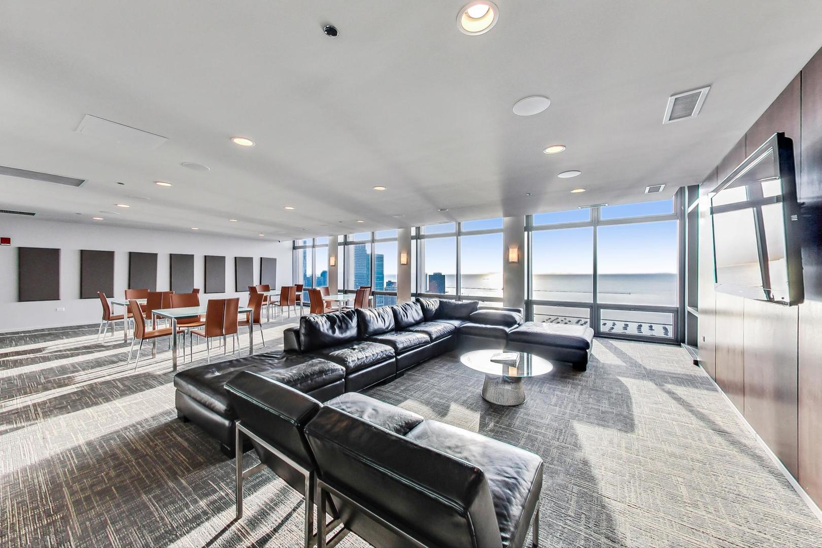 65 East Monroe Street, Unit 4405 Chicago, IL 60603 - Photo 25 of 27 a living room with furniture and a table