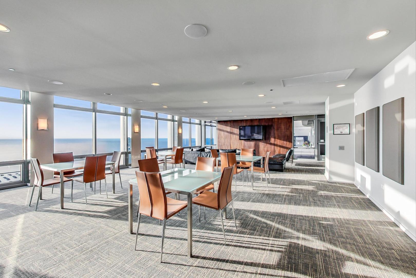 65 East Monroe Street, Unit 4405 Chicago, IL 60603 - Photo 26 of 27 a living room with lots of furniture and a table