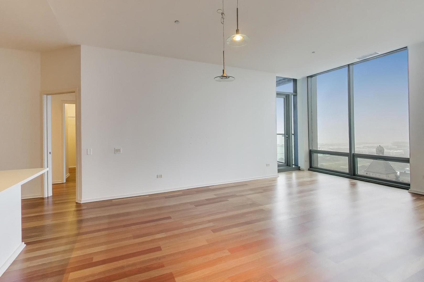 65 East Monroe Street, Unit 4405 Chicago, IL 60603 - Photo 3 of 27 a view of an empty room with wooden floor