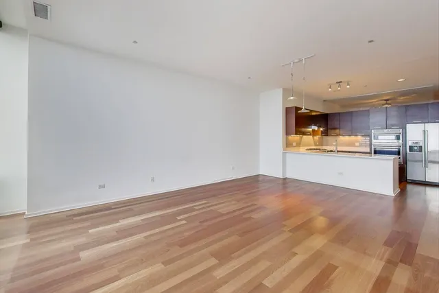 a view of kitchen with wooden floor