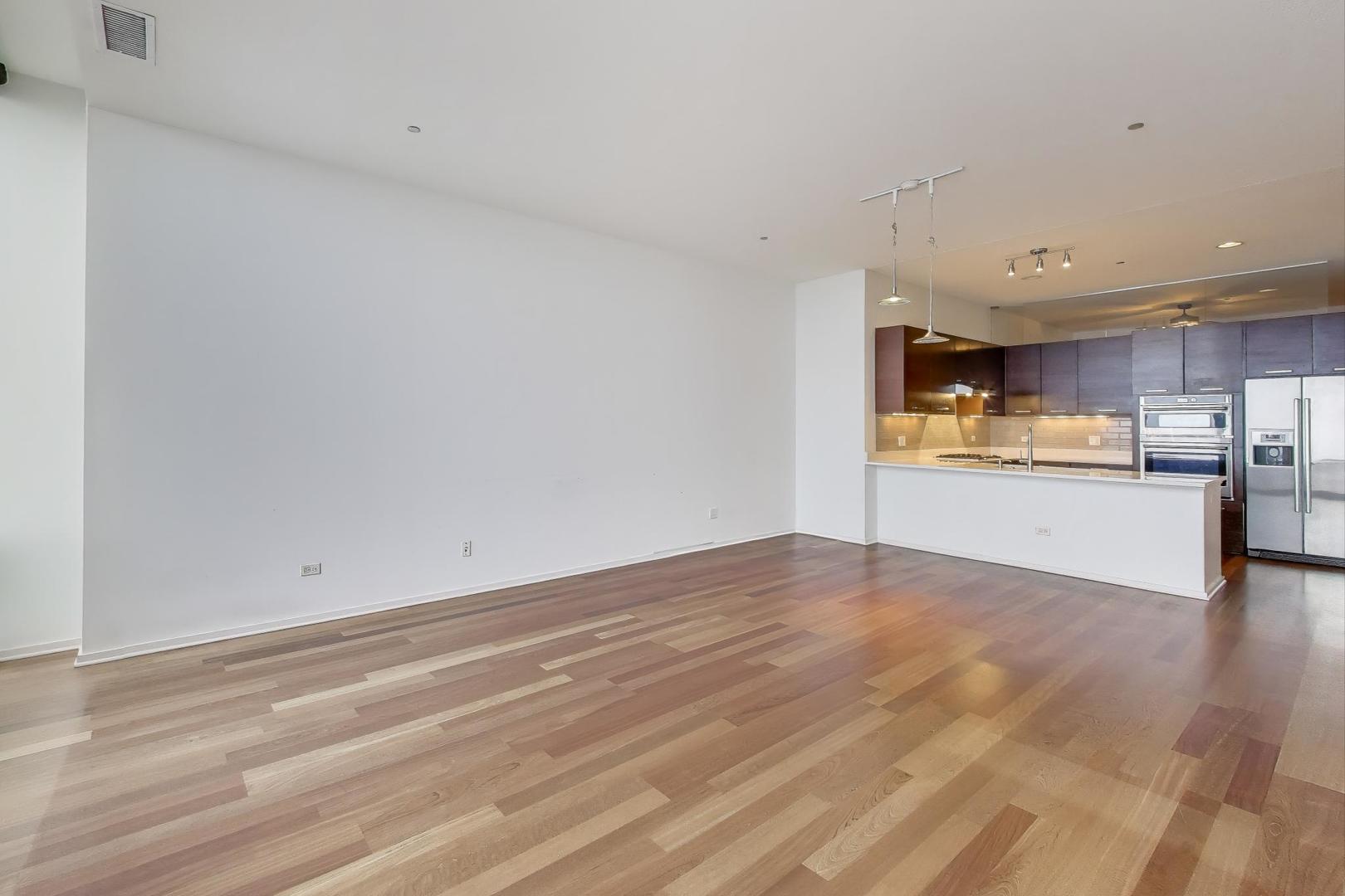 65 East Monroe Street, Unit 4405 Chicago, IL 60603 - Photo 4 of 27 a view of kitchen with wooden floor