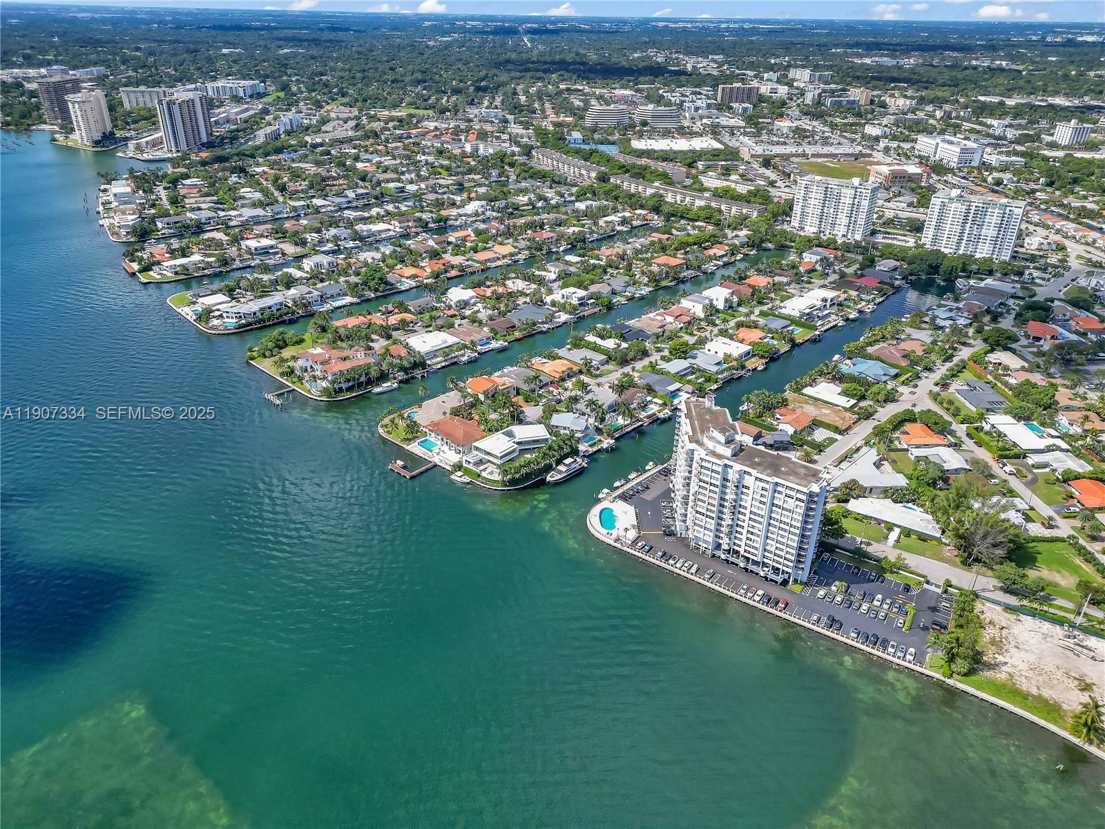 2089 Northeast 121st Road North Miami, FL 33181 - Photo 11 of 30 an aerial view of residential houses with outdoor space and trees