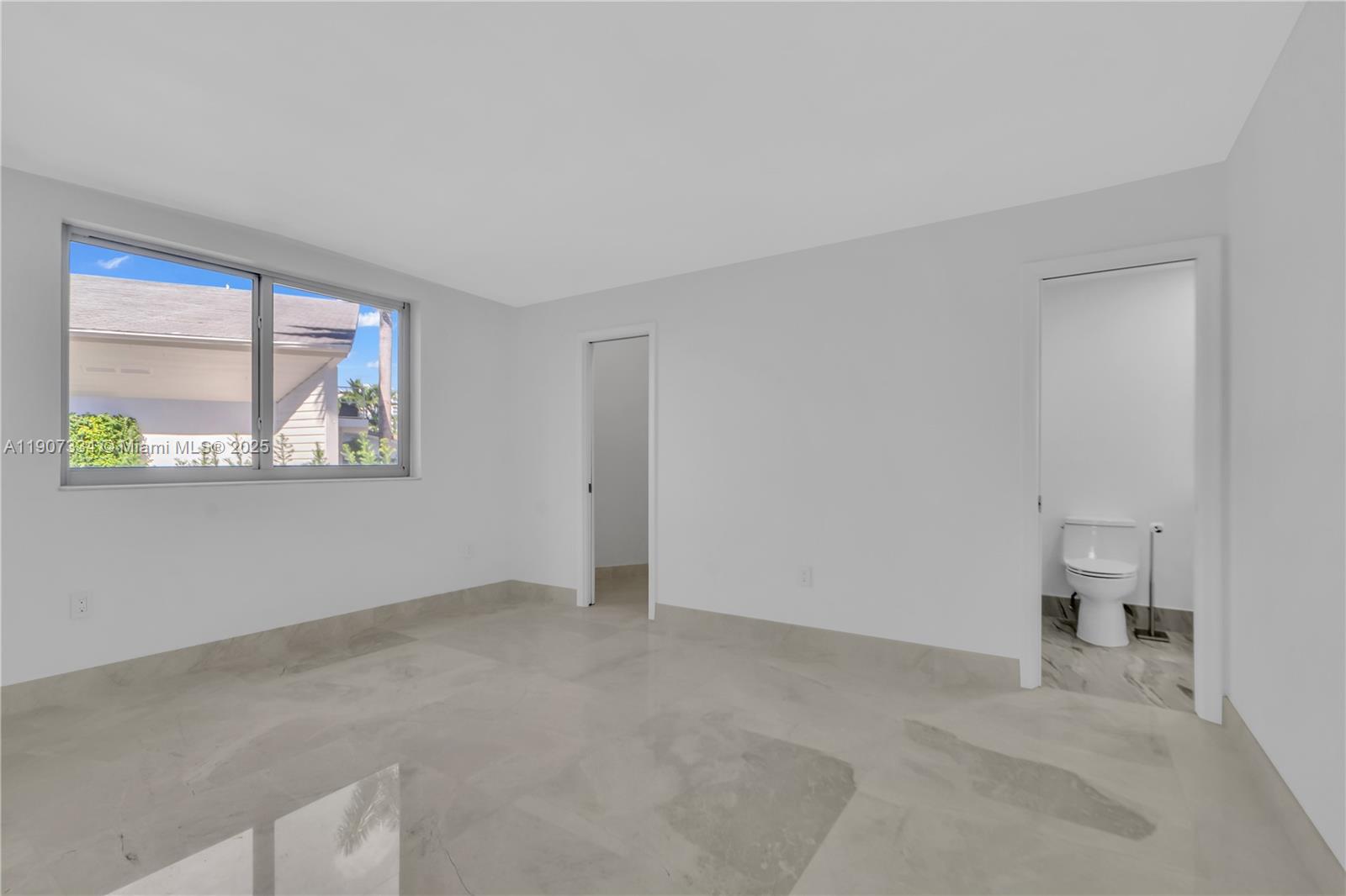 2089 Northeast 121st Road North Miami, FL 33181 - Photo 12 of 30 an empty room with windows