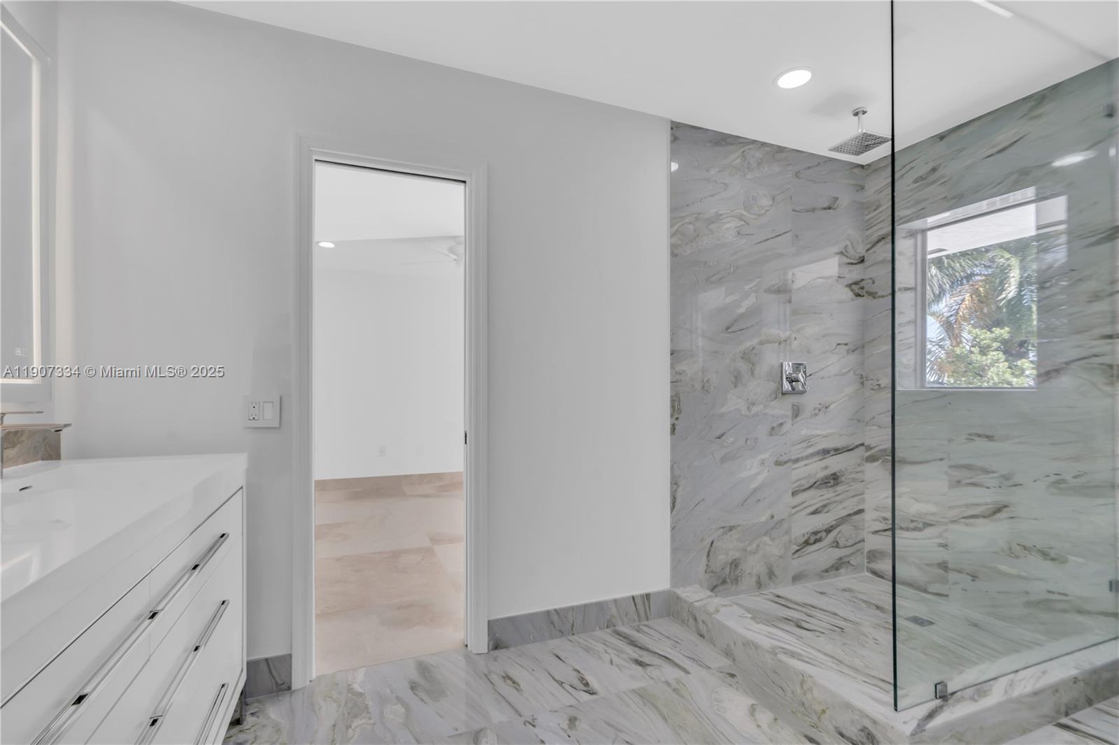 2089 Northeast 121st Road North Miami, FL 33181 - Photo 19 of 30 a bathroom with a shower and a sink