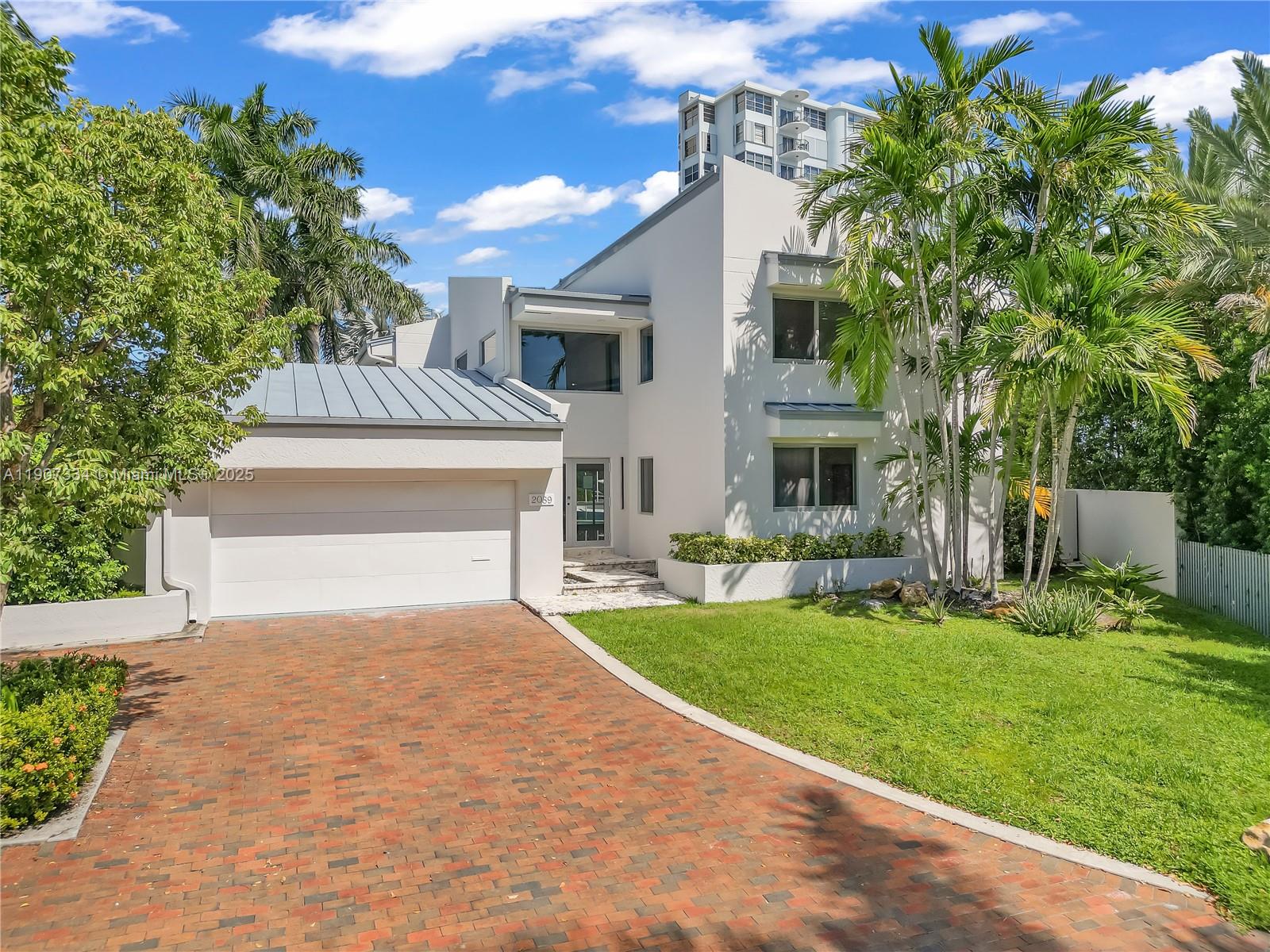 2089 Northeast 121st Road North Miami, FL 33181 - Photo 2 of 30 a front view of house with yard